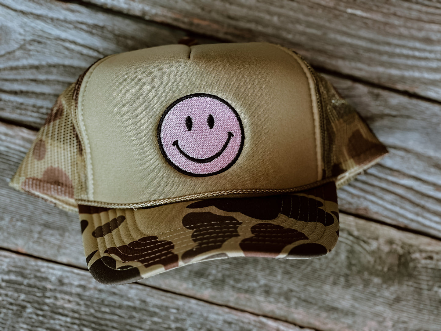 All smiles here camo trucker hat