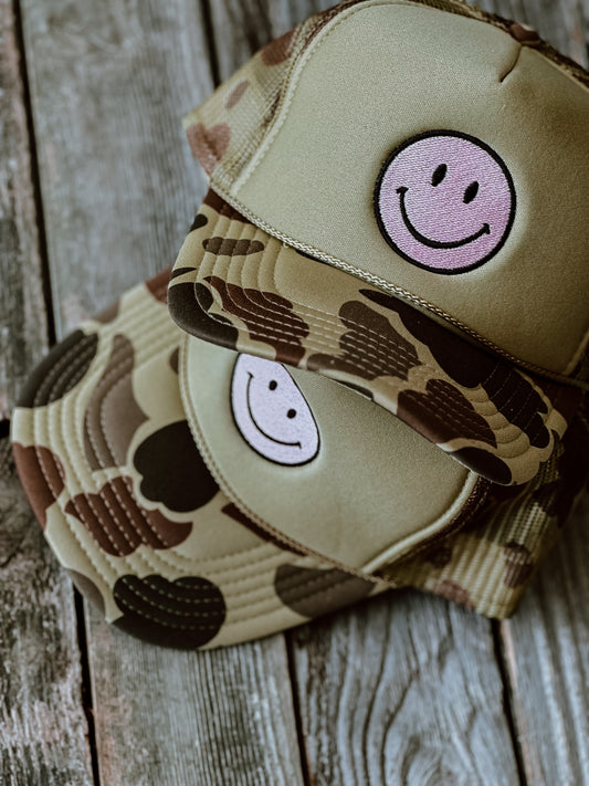 All smiles here camo trucker hat